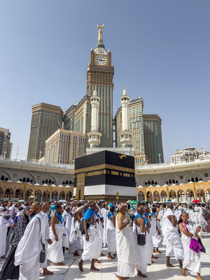 Crafting Captivating Headlines: Your awesome post title goes here A large group of pilgrims gather at the Kaaba in Mecca, Saudi Arabia, during the Hajj pilgrimage under a clear blue sky.